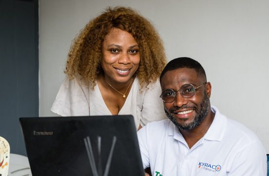 Smiling couple at their workspace in Côte d’Ivoire